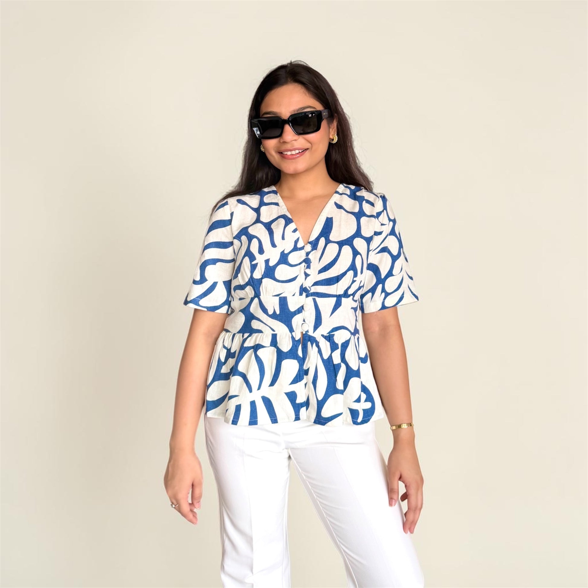 Linen Abstract Top front view — blue botanical print on ivory, V-neckline, peplum hem | Kodds