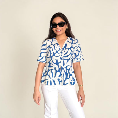 Linen Abstract Top front view — blue botanical print on ivory, V-neckline, peplum hem | Kodds