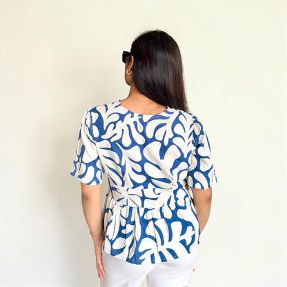 Linen Abstract Top alternate angle — fabric-covered button detail, feminine silhouette | Kodds